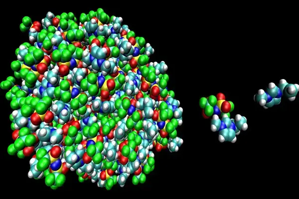 3D rendering of a large, dense molecular cluster (green, blue, white, red, yellow spheres) and smaller separate molecules.